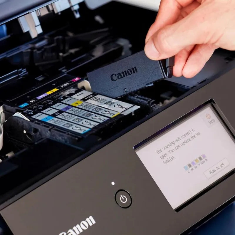 canon inks being inserted into a printer