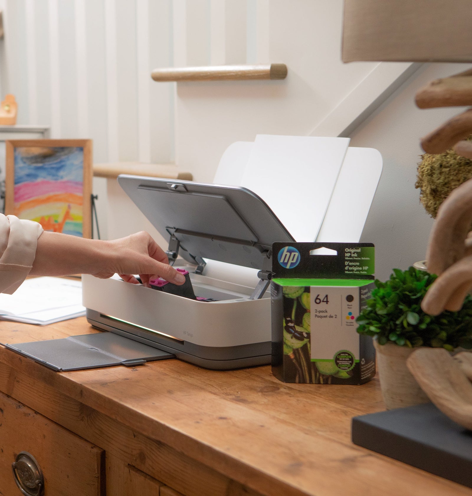 a woman troubleshoots her HP printer