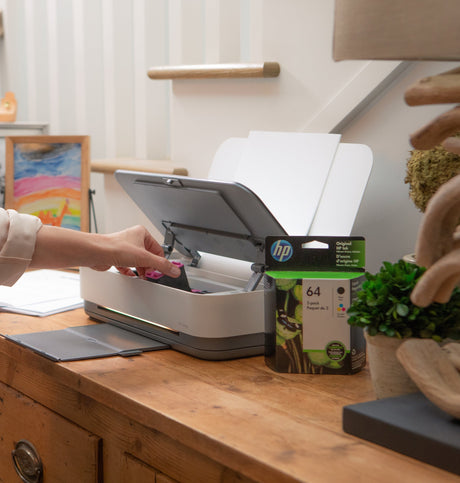 a woman troubleshoots her HP printer