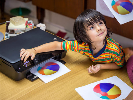 a child learns about ink recycling and ethical printing