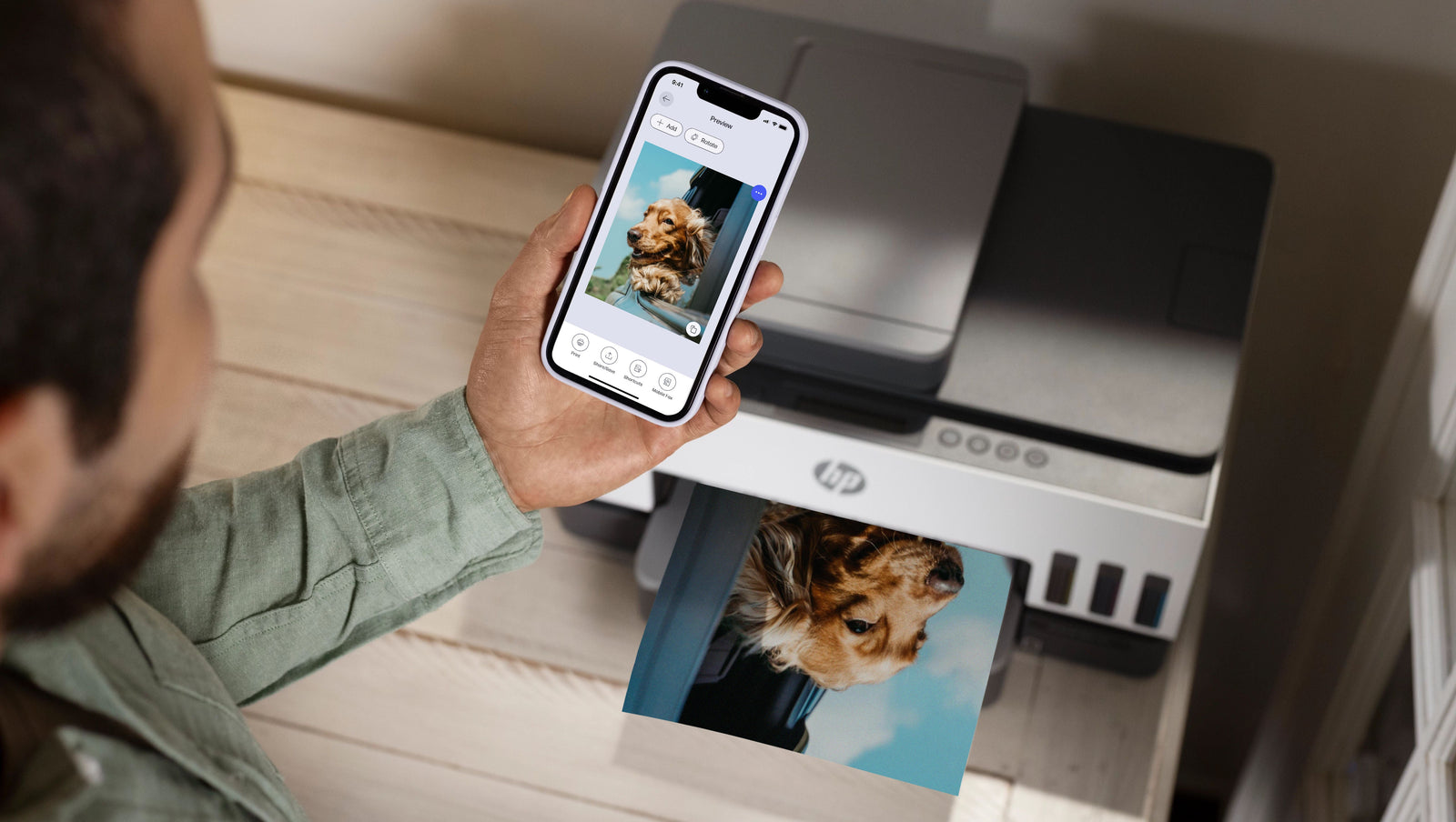 a man prints using the HP Smart App on his Phone