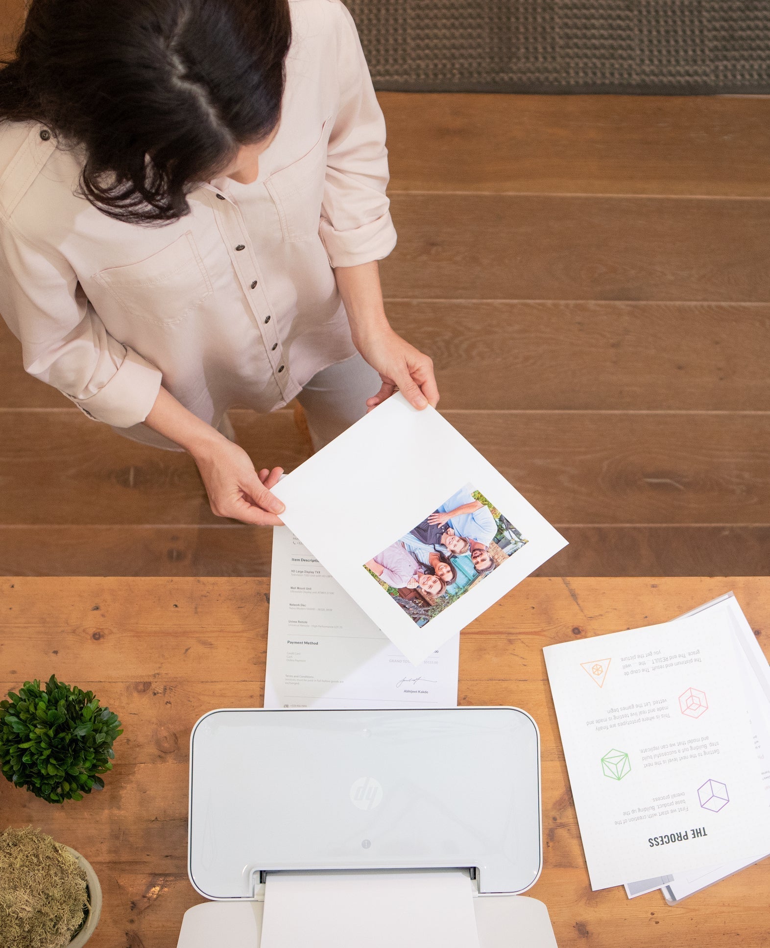 a woman analyses her printed document