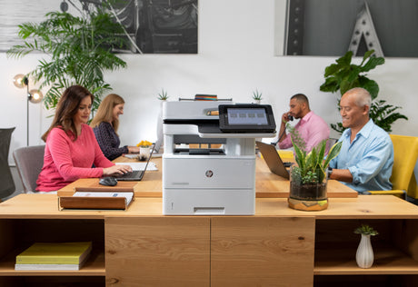 an hp printer in a bright modern office space