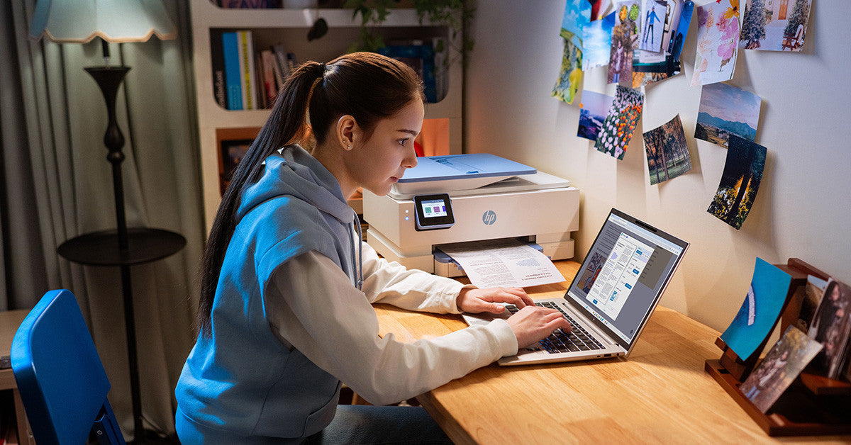 a girl prints crafts on her HP printer