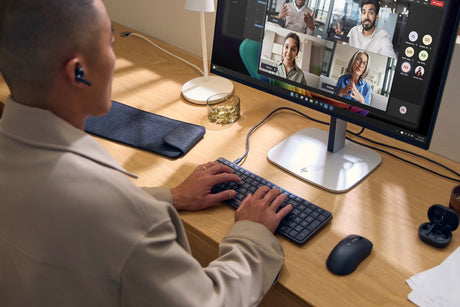 man using his HP eliteboard g1a keyboard pc