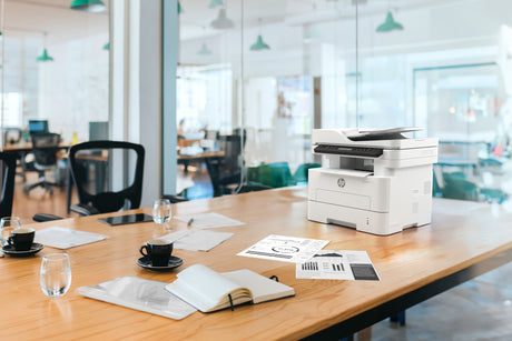 an untidy office space and printer