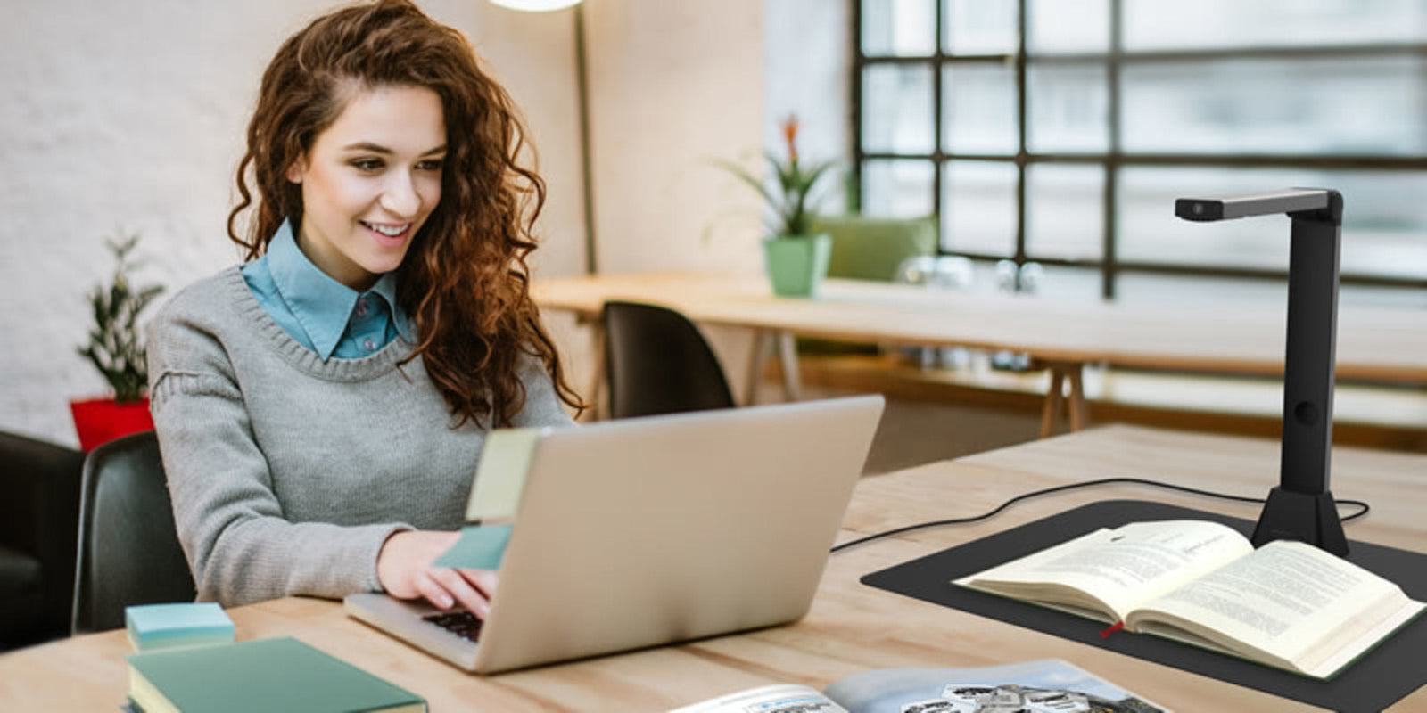 a woman shops for a new printer on her laptop