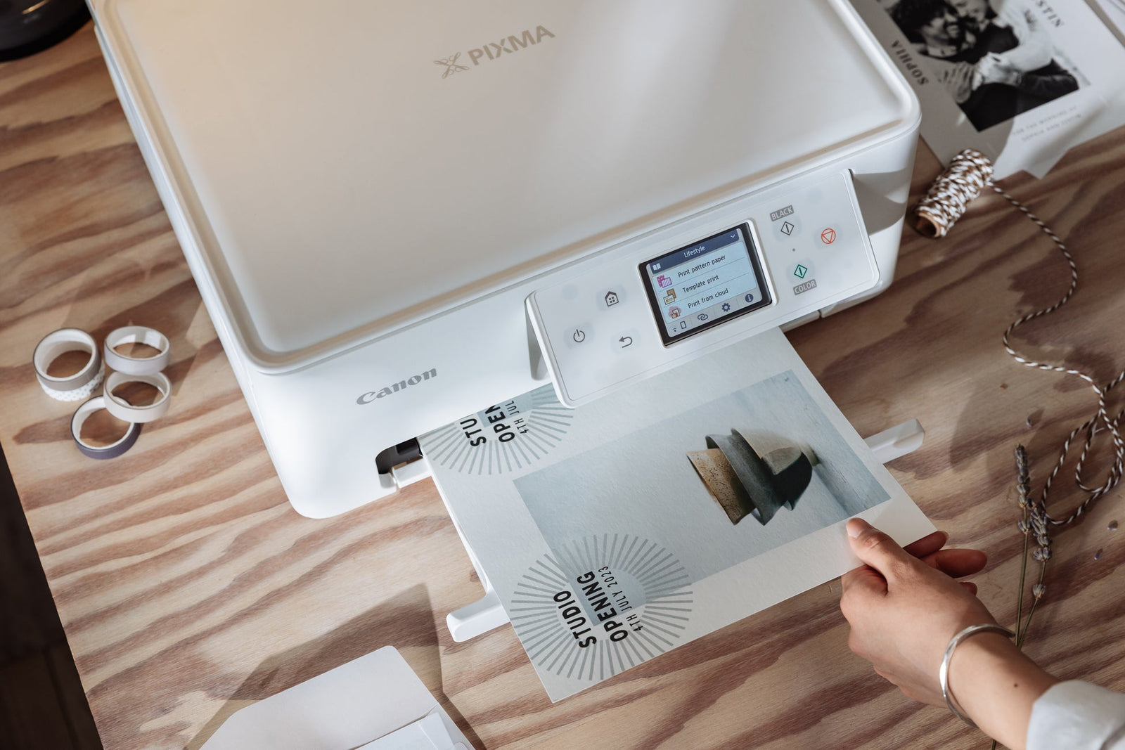 a woman prints some craft materials on her home printer