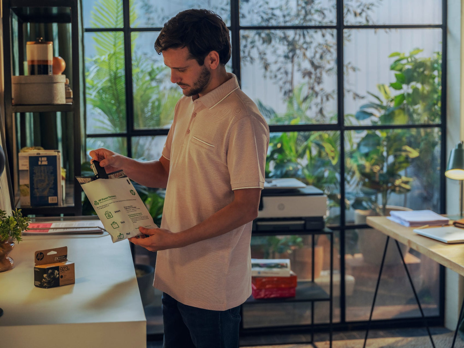 a man recycles an ink cartridge