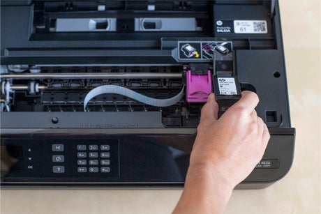 man removes his ink to troubleshoot an issue