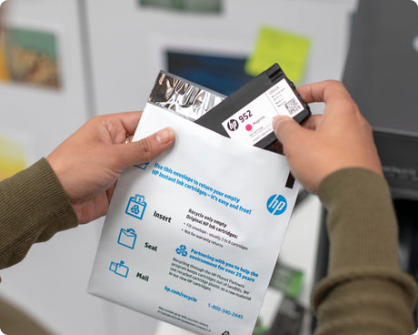 a man recycles an empty ink cartridge