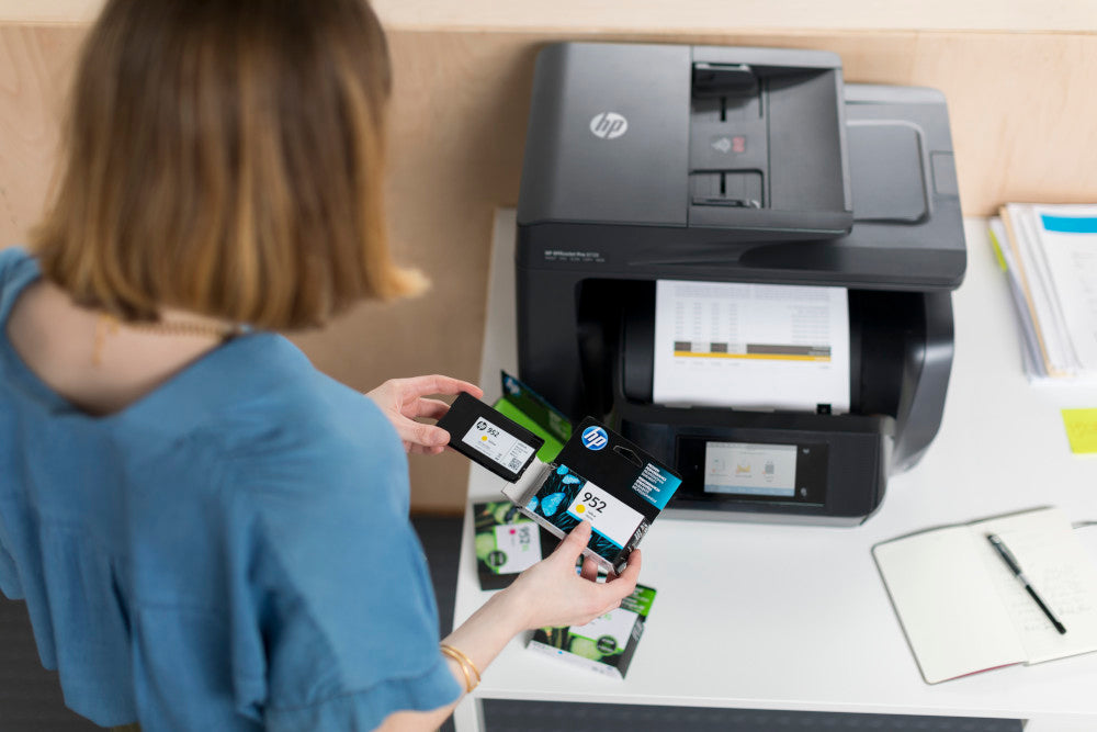 a woman looks at her hp ink cartridges